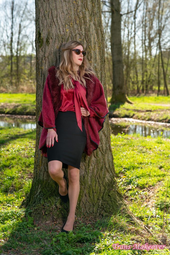 Svenja wearing an overcoat with long sleeves, and a top that covers the chest area.
